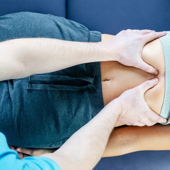 Chiropractic diaphragm myofascial release, osteopath releasing tension in diaphragm muscles to improve patent's respiratory function